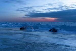 Baltic Sea Coast in Winter With Ice at Sunset photo