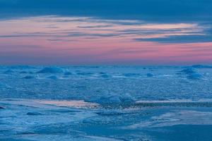 Baltic Sea Coast in Winter With Ice at Sunset photo