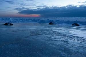 Baltic Sea Coast in Winter With Ice at Sunset photo