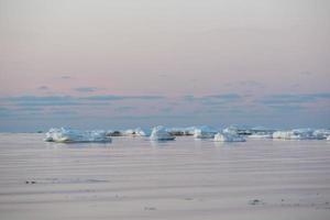 Baltic Sea Coast in Winter With Ice at Sunset photo