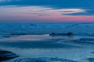 Baltic Sea Coast in Winter With Ice at Sunset photo