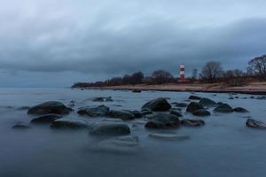 Baltic Sea Coast in Winter With Ice at Sunset photo