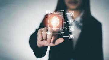 Business woman poin finger to access on screen for search engine with cloud computing diagram show on hand. Cloud technology. Data storage. Networking and internet service. Business technology concept photo