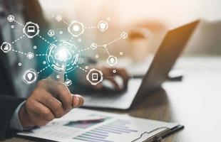 Business man finger touch on screen cloud computing provides security access with biometrics identification and using laptop. Business Technology Safety Internet Network Concept. Security scanning. photo