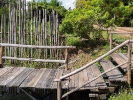 The wooden bridge along the small pond. photo