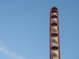 Ferris wheel against the sky. Amusement park on the sea. Rest zone. photo