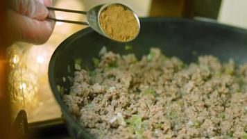 Mix all ingredients with a wooden spoon. Cook chili con carne, Mexican cuisine video