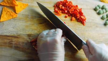 I hold a Sweet Red Kapia Peppers cut into small pieces. Macro shooting video