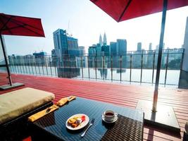 Having breakfast at the roof top pool in Kuala Lumpur photo