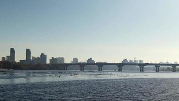 4K footage of the Patona Bridge on a foggy morning at sunrise across the Dnieper River in Kyiv, Ukraine. City traffic over the bridge towards Rusanivka island in Kyiv in autumn. video