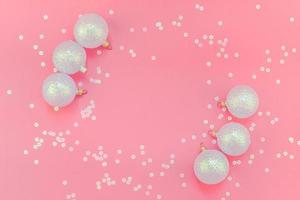 Christmas pink flat lay pattern with pearl balls photo