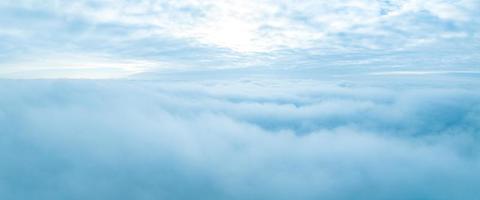 Flying above the stormy clouds. Aerial close up cloud view. photo
