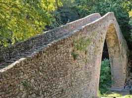 Portaikos River single arch Bridge at Pyli, Greece photo