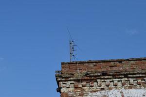 The television antenna on the rooftop photo