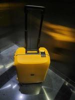 Jakarta, Indonesia in October 2022. A Voja type lojel suitcase with small size and yellow color. photo