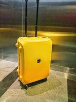 Jakarta, Indonesia in October 2022. A Voja type lojel suitcase with small size and yellow color. photo