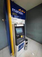 Jakarta, Indonesia in July 2022. This is a photo of an Automated Teller Machine or ATM from Bank Mandiri.