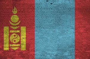 Mongolia flag depicted in paint colors on old brick wall. Textured banner on big brick wall masonry background photo