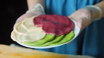 Tortillas prepared and decorated with spinach and beets. Red and green tortillas video