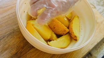 Boil the potatoes in an iron bowl. Macro shooting on intense steam video