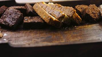 Different kinds of cakes arranged on a wooden tray video