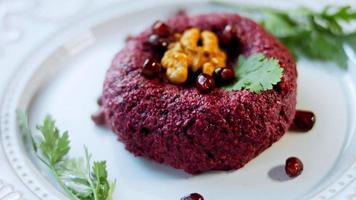 Pkhali traditional Georgian food. Beetroot is used for the purple color. Walnut is used for decoration video