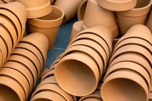 Stack of unpainted clay pots photo