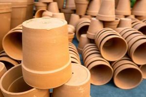 Stack of unpainted clay pots photo