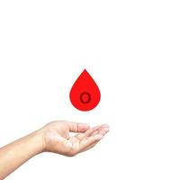 Medical and healthcare concept. Hand catch O blood drops, charity and care. photo
