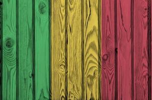 Mali flag depicted in bright paint colors on old wooden wall. Textured banner on rough background photo