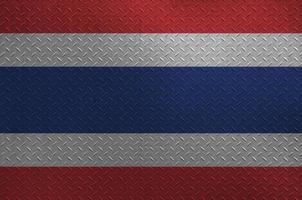 Thailand flag depicted in paint colors on old brushed metal plate or wall closeup. Textured banner on rough background photo