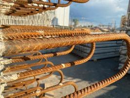 Iron metal rusty reinforcement in concrete and industrial reinforced concrete slabs used in the construction of buildings and structures photo