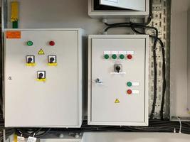 Control panel for electrical equipment. Electric remote control. Remote control production equipment. Administration shields with buttons and monometers photo