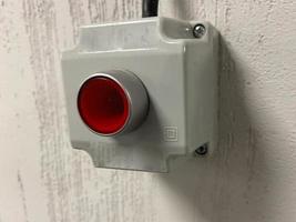 Plastic red stop button for industrial process with others buttons photo