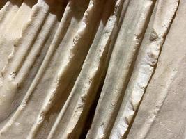 Texture of light gray marble with white lines of a pattern, macro background. Ivory color stone backdrop photo