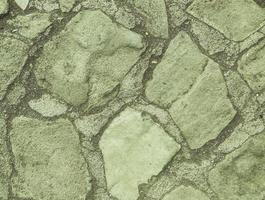 the stone is natural, the path is lined with stones for the convenience of tourists. natural gray texture. large stones of different colors to create roads photo