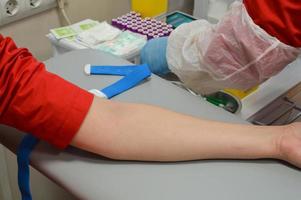 Taking blood in the laboratory for analysis photo