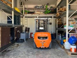 The mechanic is checking the quality and Maintenance Forklift,Energy fuel concept. photo
