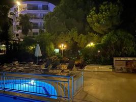 Swimming pool at night in Sharm el Sheikh, Egypt photo