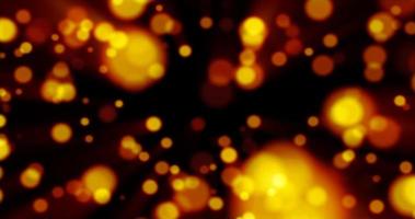 Beautiful festive bokeh effect, orange gold circles of light shining falling falling glowing christmas new year on black background. Abstract background. Screensaver photo