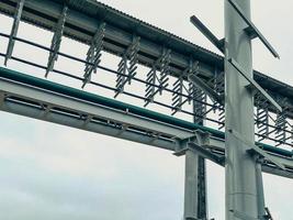 construction of a gas pipeline in a mining complex. construction of a new industrial complex. metal fittings, next to a tall pole for power lines photo