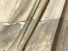 Texture of convex plaster. The rough finish of the wall photo