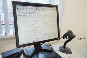 laboratory for analysis. the monitor reflects the research data, the state of the equipment. near the barcode reader on the test tubes. health diagnostic tests photo