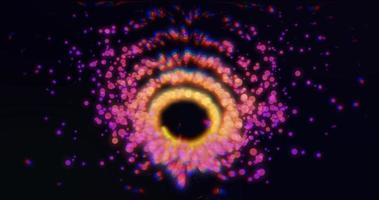 Abstract with a beautiful purple funnel swirl of particles of bright glowing smoke magical energy effect on a black background photo
