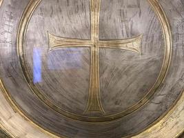 medieval knight shield and crossed swords on wooden gate photo