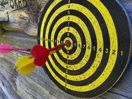 dart arrow hitting in the target center of dartboard,abstract of success photo