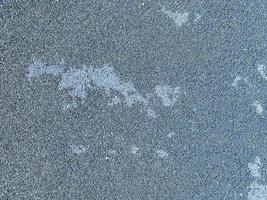 gray texture, stones of different colors. a background of small multi-colored stones that are tightly packed into the road. covering for walking the population photo