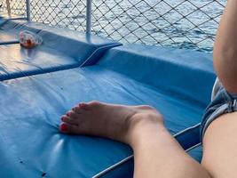 Close up of woman's foot on blue mat photo