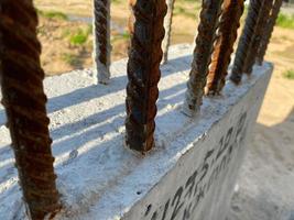 Iron metal rusty reinforcement in concrete and industrial reinforced concrete slabs used in the construction of buildings and structures photo