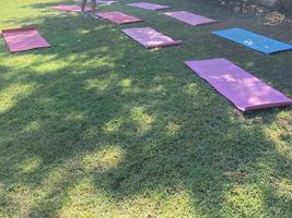 Yoga mats on the grass. Fitness concept photo